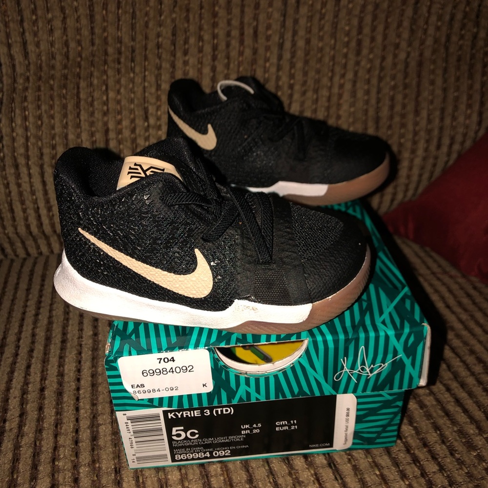 Black and gold Nike